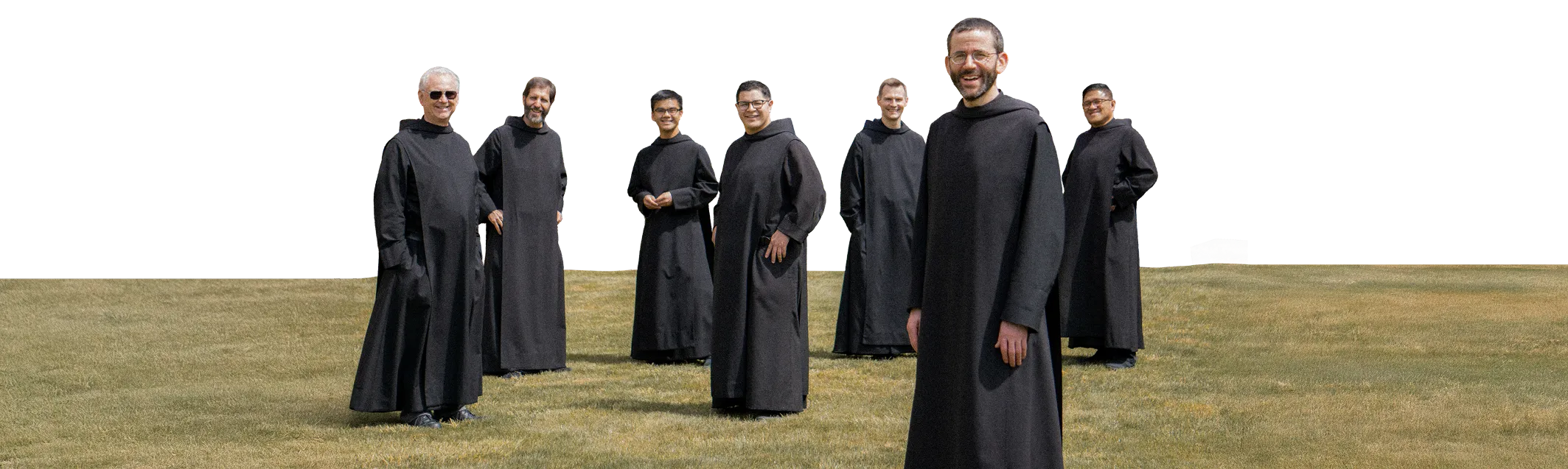 The monks of Monk Mindset standing together in an open field.